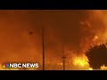 Fire blows up in Southern California, destroying homes and forcing thousands to evacuate