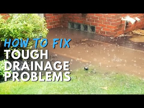 How do you fix drainage problems in your yard?