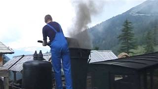 Schneebergbahn – cogwheel steam train at middle station being filled with water