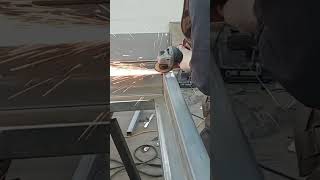 Grinding welds with a hand grinder