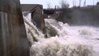 Water rages over the Winooski dam