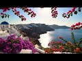 Santorini Garden Balcony View — Flowers overlooking the famous caldera.