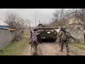 ukrainian civilians greet with sweets ukrainian soldiers passing through the liberated village