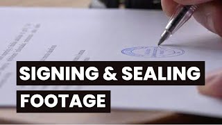 Stamping and signing a document in slow motion. Free HD video footage