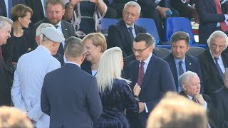 Merkel, Pence and other officials arrive at WWII commemoration ceremony | AFP