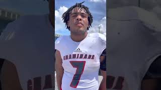 Davion Gause (2024 Miami target) talks with Frank Tucker after a 42-14 win over Miami Northwestern