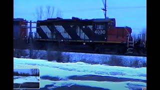 Four GP38s, four paintjobs. CN GP9RM.  Roots Blower roar. 2/13/2000