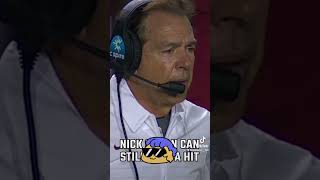 Nick Saban takes a hit on the sideline at LSU