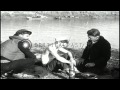 Rescue boats bring survivors of USS Panay to an island for medical attention. HD Stock Footage