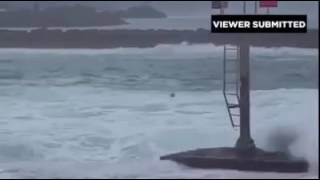 Outrigger crew gets caught in high surf at Boat Basin