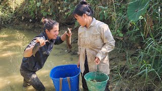 Two single mothers went fishing in a small pond next to a stream.