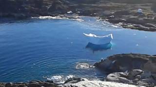 Iceberg flips over in Greenland