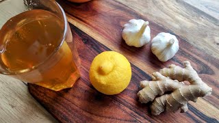 Homemade syrup for colds and strengthening immunity. Honey, lemon, ginger, and garlic.