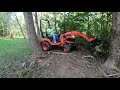 kubota burning stumps and brush backfilling holes