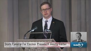 Joshua Carter, grandson of Jimmy Carter, reads at state funeral