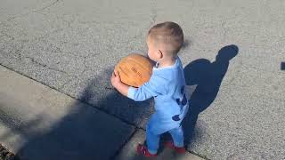 Calvin punting the basketball!