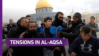 Palestinians pray in the al-Rahmeh gate in al-Aqsa compound