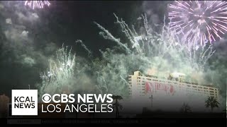 The Las Vegas Tropicana hotel is demolished with an implosion as fireworks celebrate