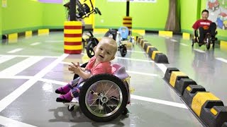 Toddler with paralysis zips around in homemade wheelchair