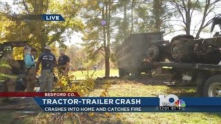 Tractor-trailer crashes into home in Moneta then catches fire