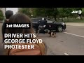 Driver hits George Floyd protester in downtown Denver | AFP