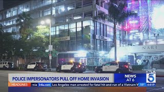 Suspects posing as police officers robbed victim at Koreatown apartment complex