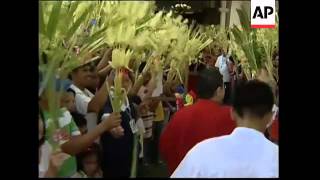 Catholics attend Palm Sunday services at start of Holy Week