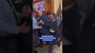 Georgia senator 'banned' and TACKLED to the ground