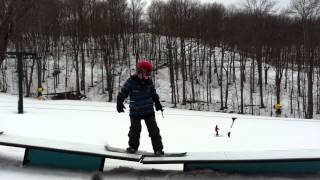 kid snowboarder in terrain park