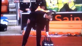 Football coach Nigel Adkins falls over bottles
