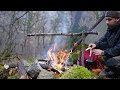 solo two days winter bushcraft camp building a raised shelter in snowfall