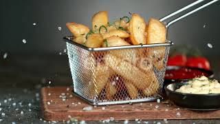 Super Slow Motion Shot of Adding Salt on Fresh Steak Fries at 1000Fps.