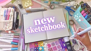 starting & customising my new sketchbook ♡ drawing on the cover, first page & more!