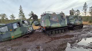 Hägglunds Bandvagn 206 Stuck in the mud being towed.