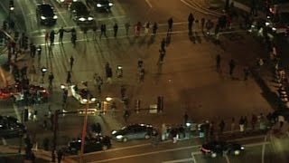 Protesters form human chain, block intersection