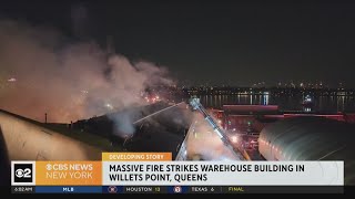 2 firefighters hurt battling Queens warehouse fire