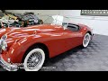 1957 jaguar xk140 roadster. ots. carmen red with original black leather trim black top sidescreens