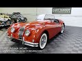 1957 jaguar xk140 roadster. ots. carmen red with original black leather trim black top sidescreens