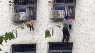 Hero scales third floor window to save dangling toddler