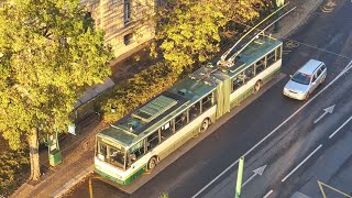 Retro Trolleybus Driving through City at Sunrise TOP DOWN View | Stock Footage - ASW Media