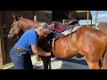 instructor diane shaw demonstrates saddling with center fire rigging