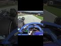 Fernando Alonso casually driving at 200 mph and wagging his finger at Yuki Tsunoda