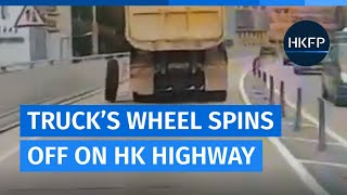 Lucky escape: Dashcam captures moment truck's wheel spins off on Hong Kong highway