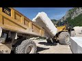 Huge Komatsu WA900 Wheel Loader Loading Marble Blocks On Cat 775E Dumpers - Birros Marble Quarries