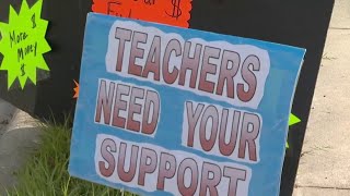 Teachers rally for higher pay