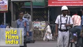 Traffic cop on duty in Kolkata - Calcutta Police booth and policemen