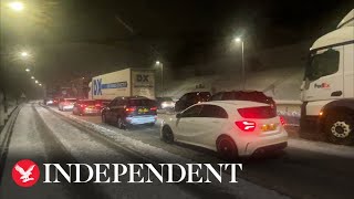 Cars stranded on motorway as M62 at standstill following heavy snow