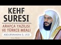 Abdurrahman al-Ussi with the Arabic writing and reading of Surah Al-Kahf