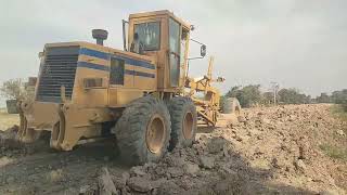 Motor Grader and Roller are Mixing Embankment Layer