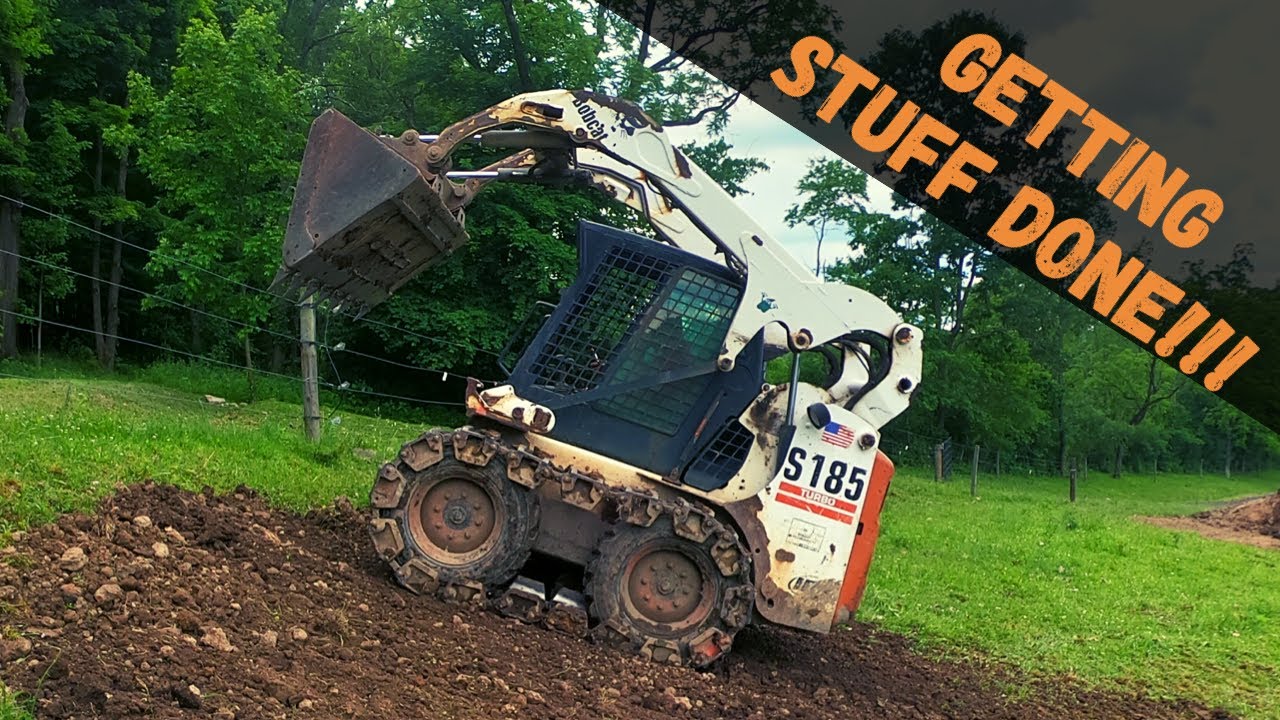 Skid Steer Placing Rubble Loading And Spreading Topsoil Tractor Cold